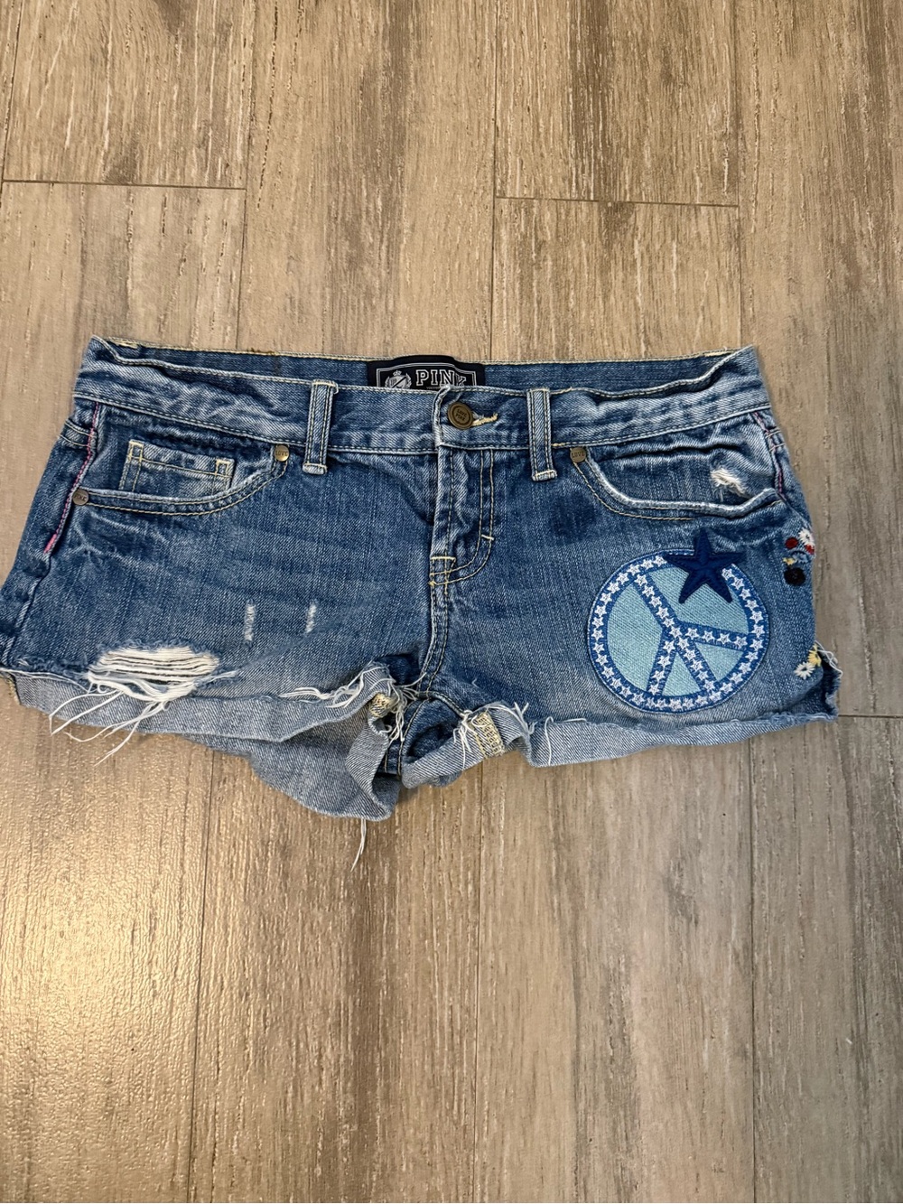 PINK Victoria's Secret Blue Distressed Denim Shorts with Peace Patch